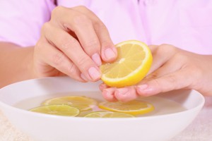 bowl of pure water with citrus fruits - hands care